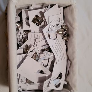 Basket of wedding bells attached to cards.
